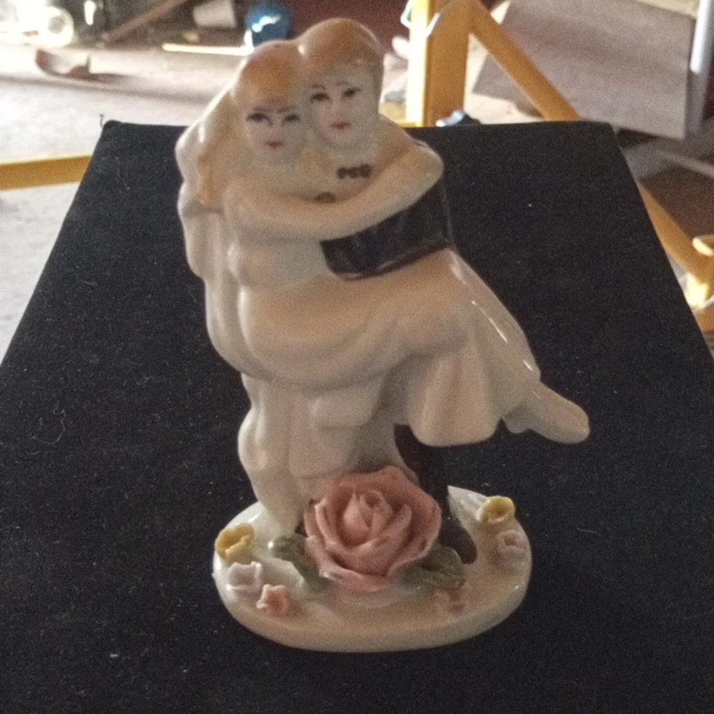 Porcelain Figurine with Floral Base